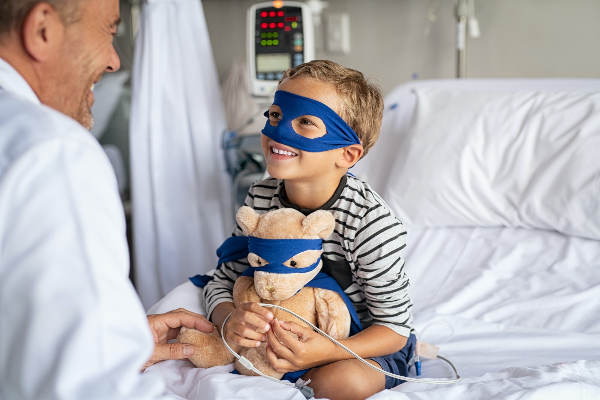 Doctor visit superhero child at hospital